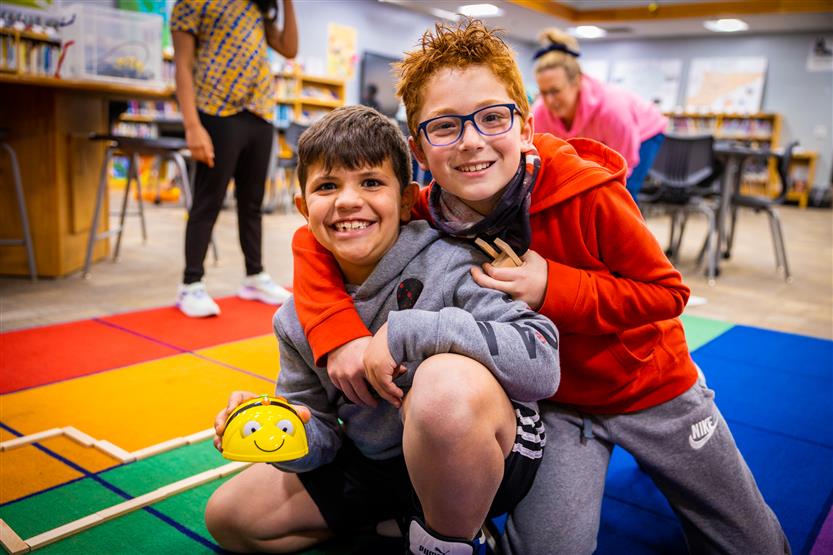 Students use Bee-Bots in the Learning Commons